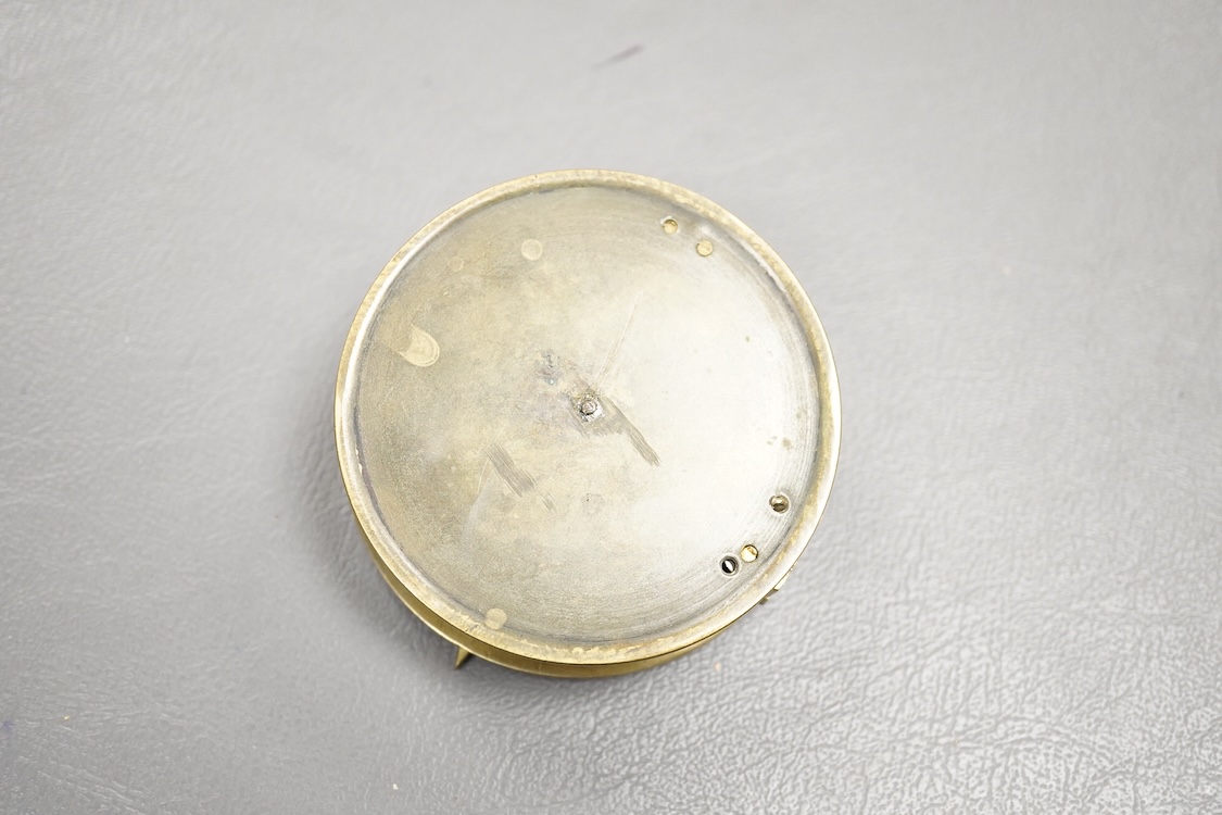 A mid 19th century brass pocket sundial, by F.L. West, 31, Cockspur St., London, with a folding gnomon and latitude scale, 6.5cm diameter